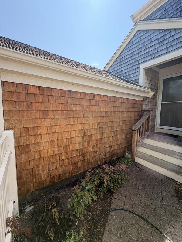 Cedar shingle wall restored to its natural color