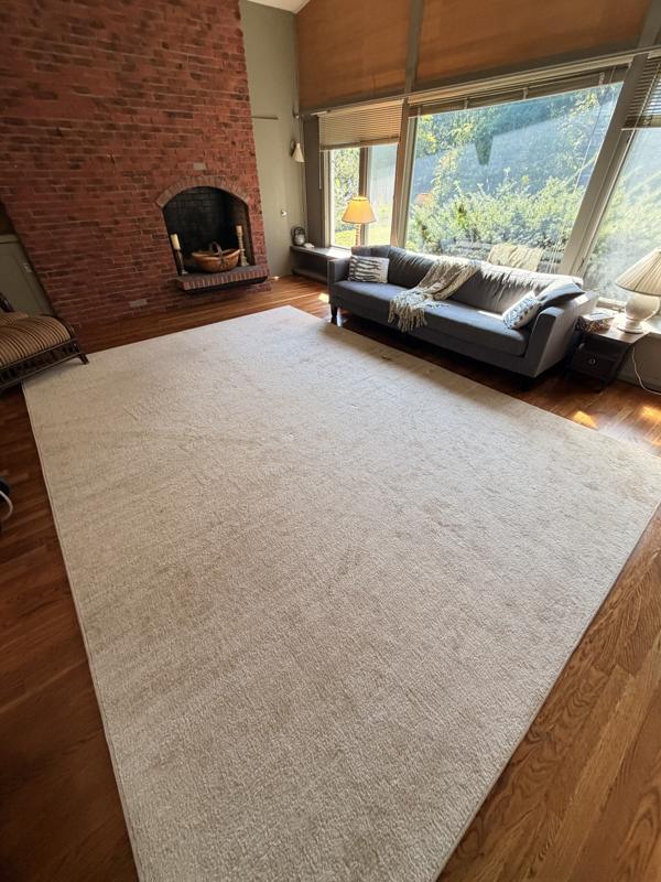 Large area rug with dull, soiled spots